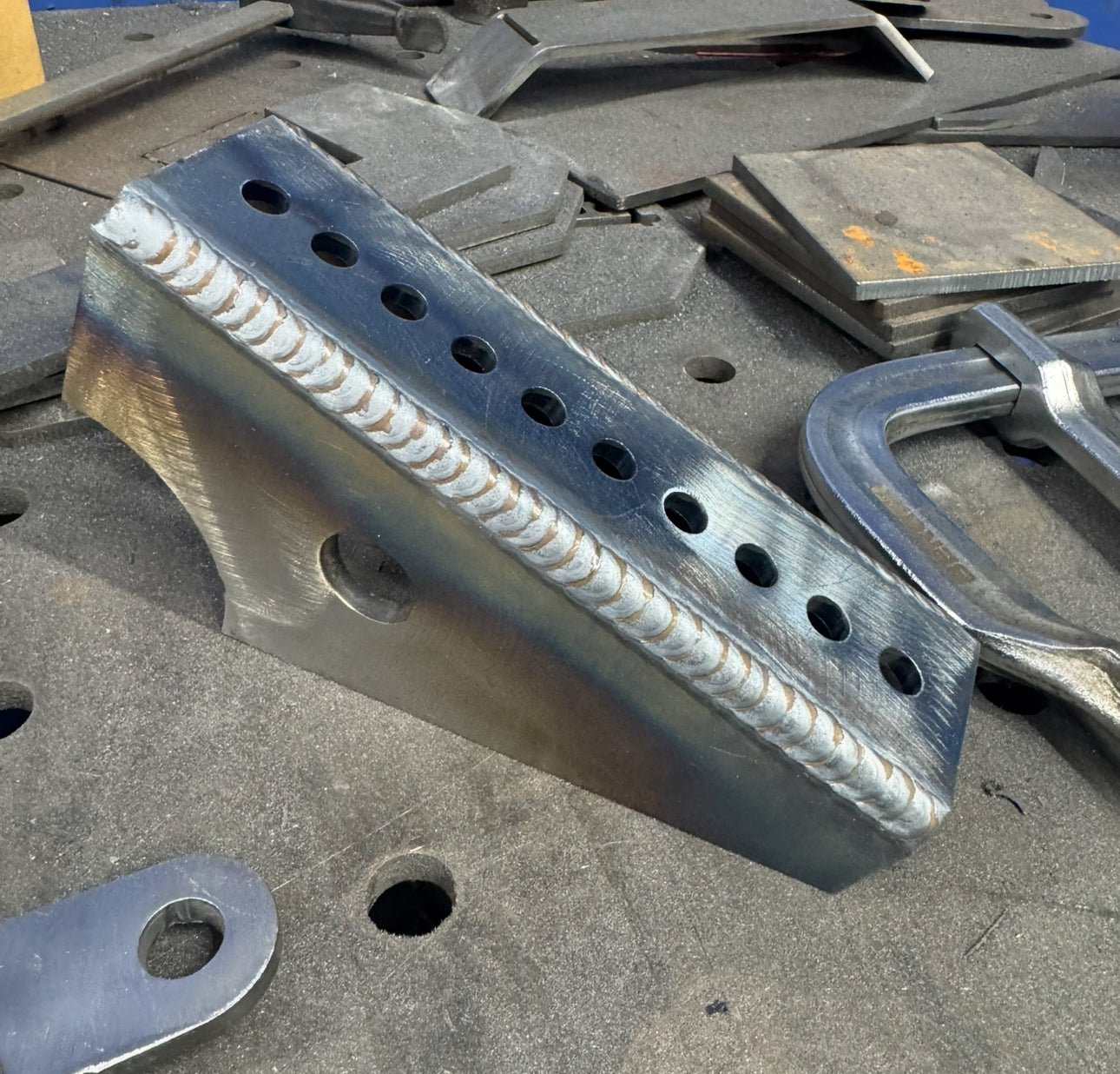 Adjustable shock relocation brackets