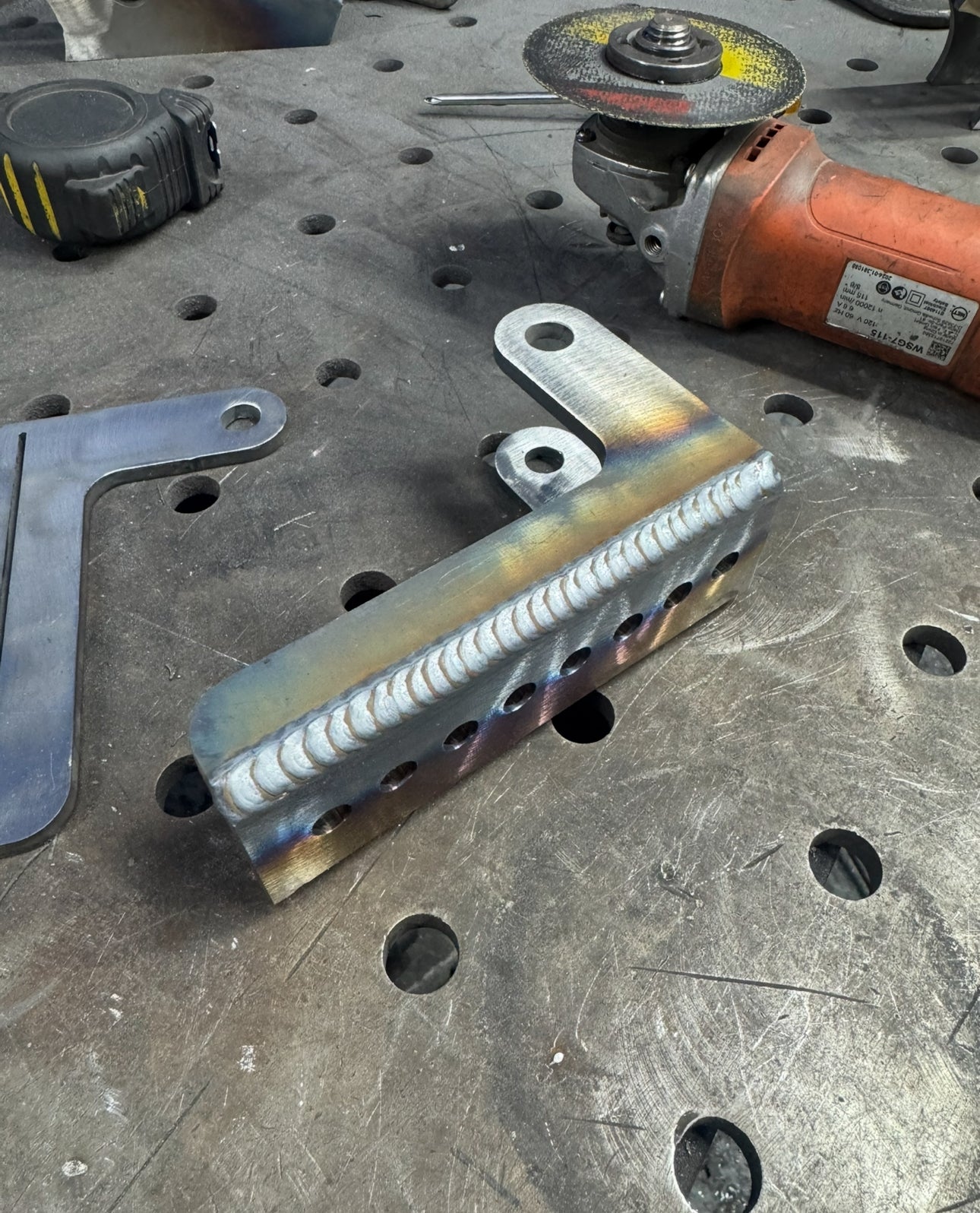 Adjustable shock relocation brackets